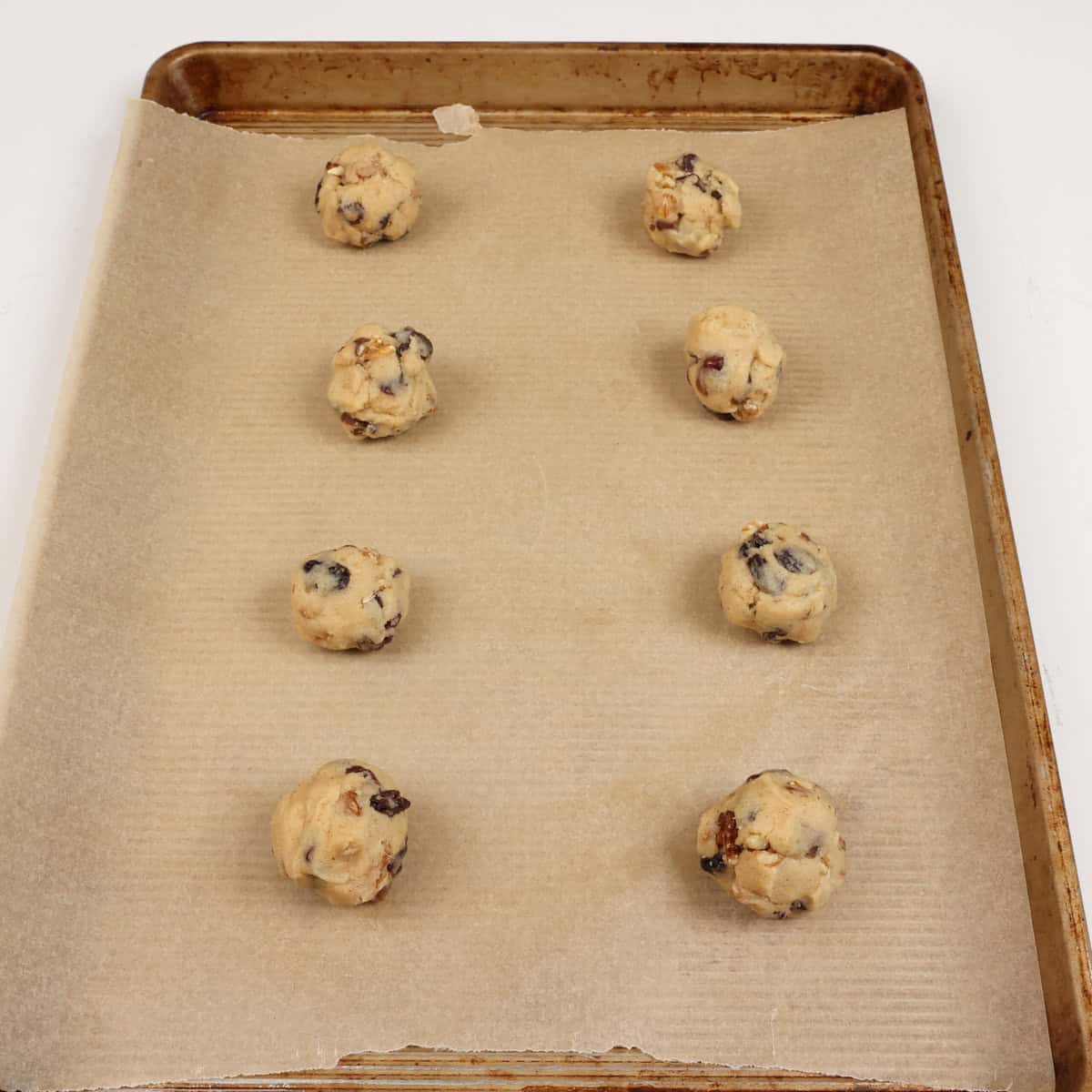 unbaked hermit cookies on a cookie sheet.