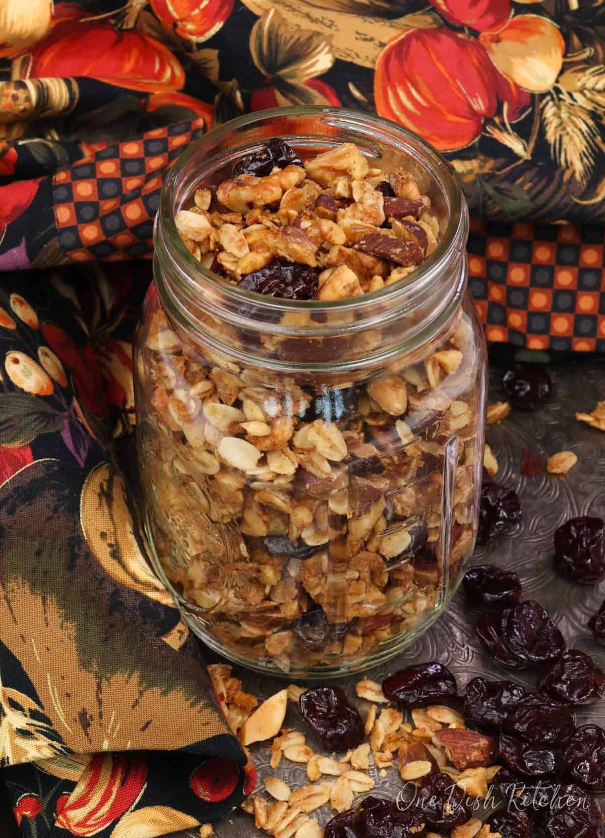 a mason jar filled with maple granola.