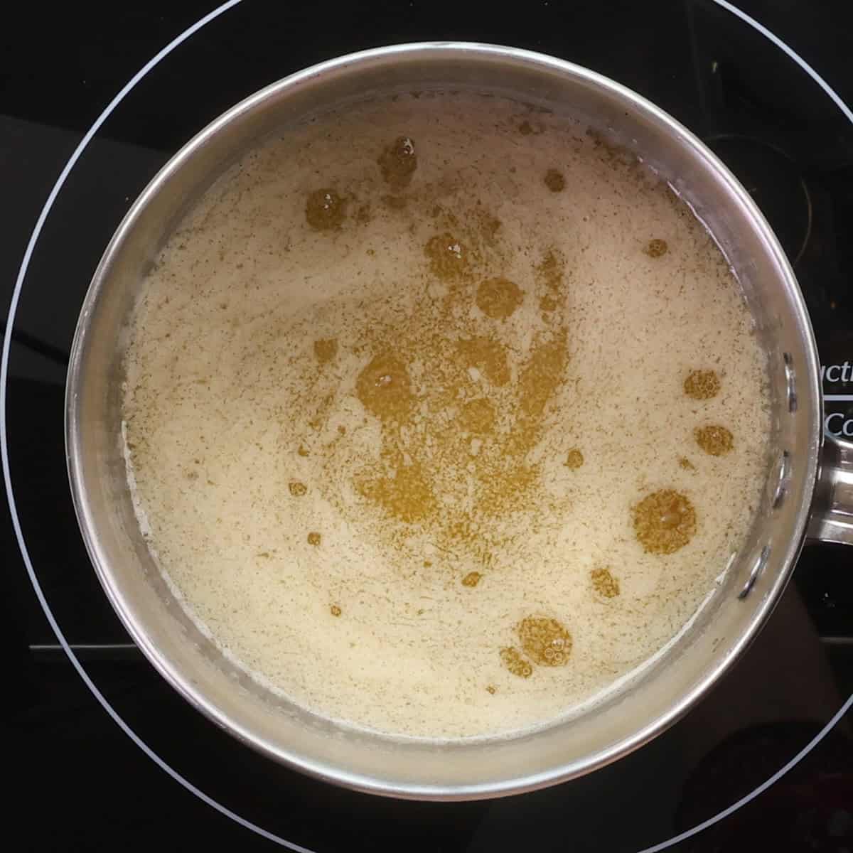 melted butter and maple syrup simmering in a small pot.