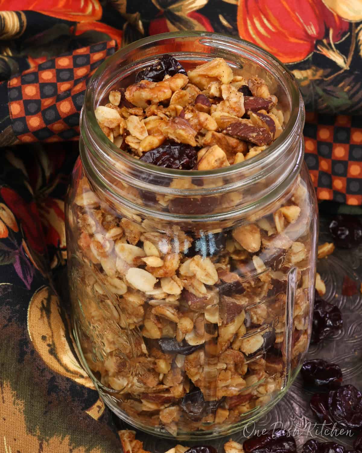 a mason jar filled with homemade maple granola.