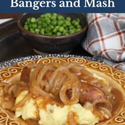 bangers and mash on a gold plate.