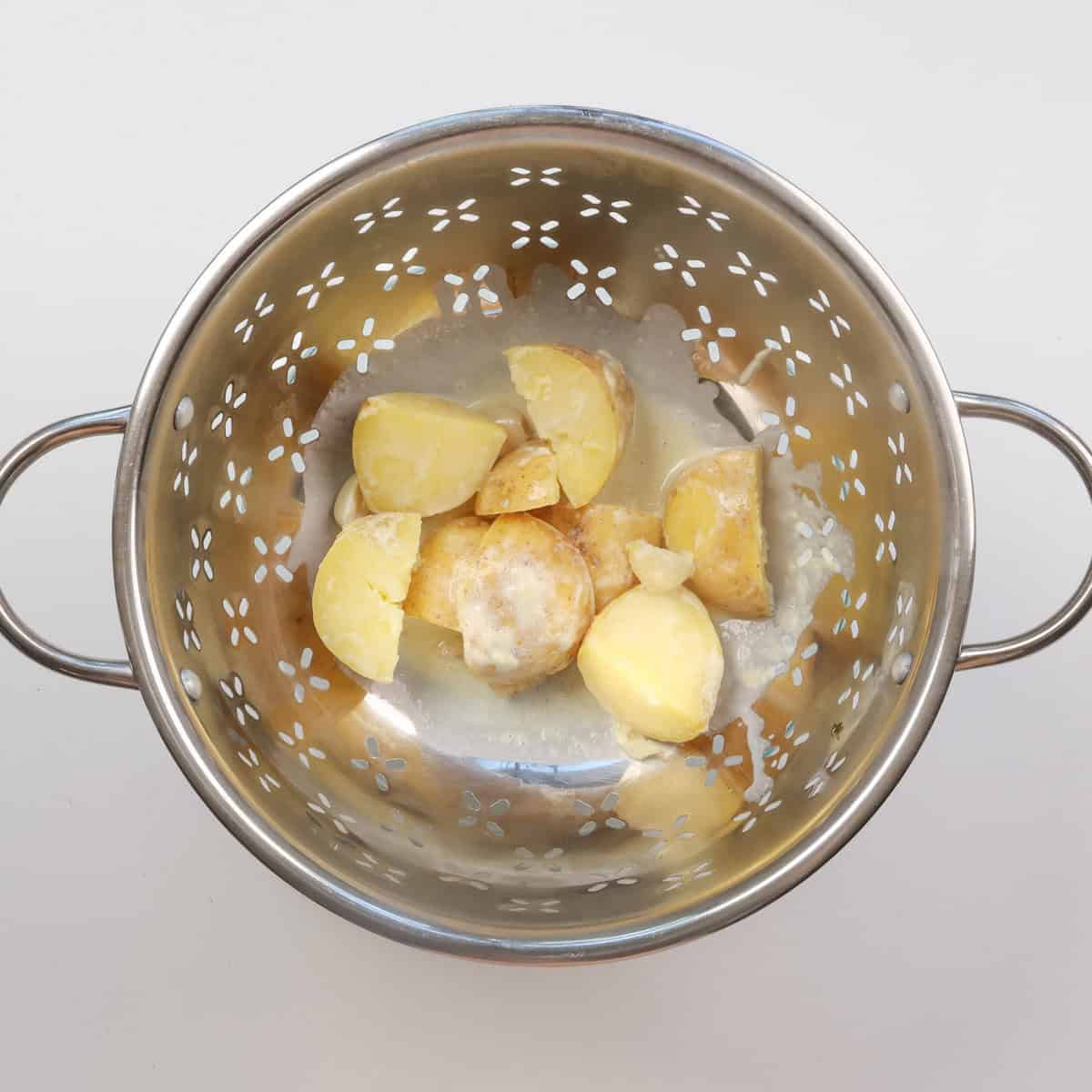 cooked potatoes in a colander.