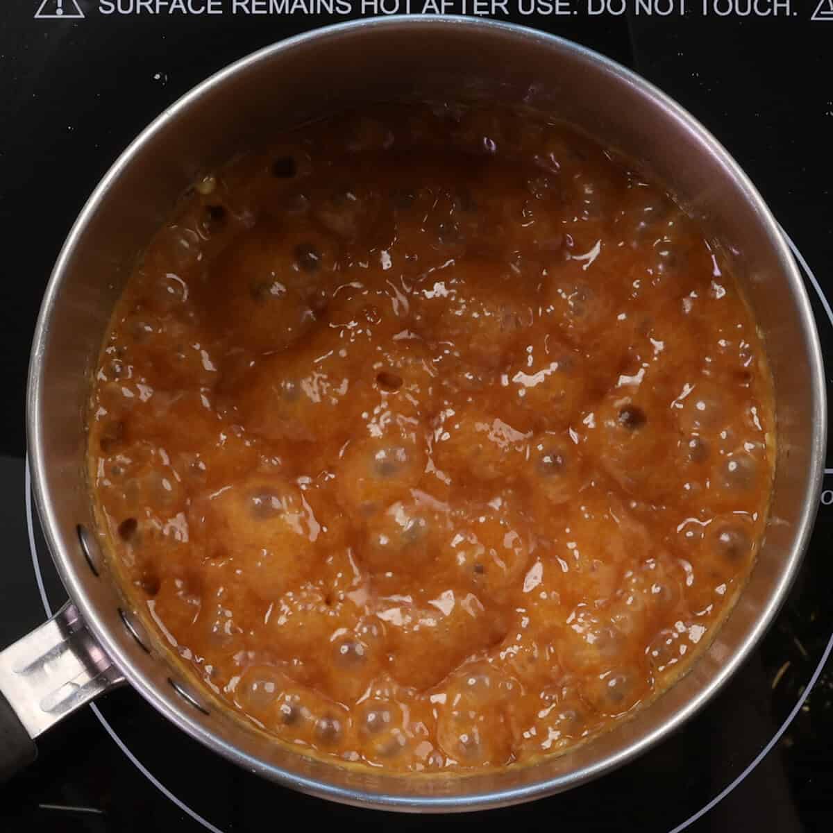 caramel simmering in a pot.