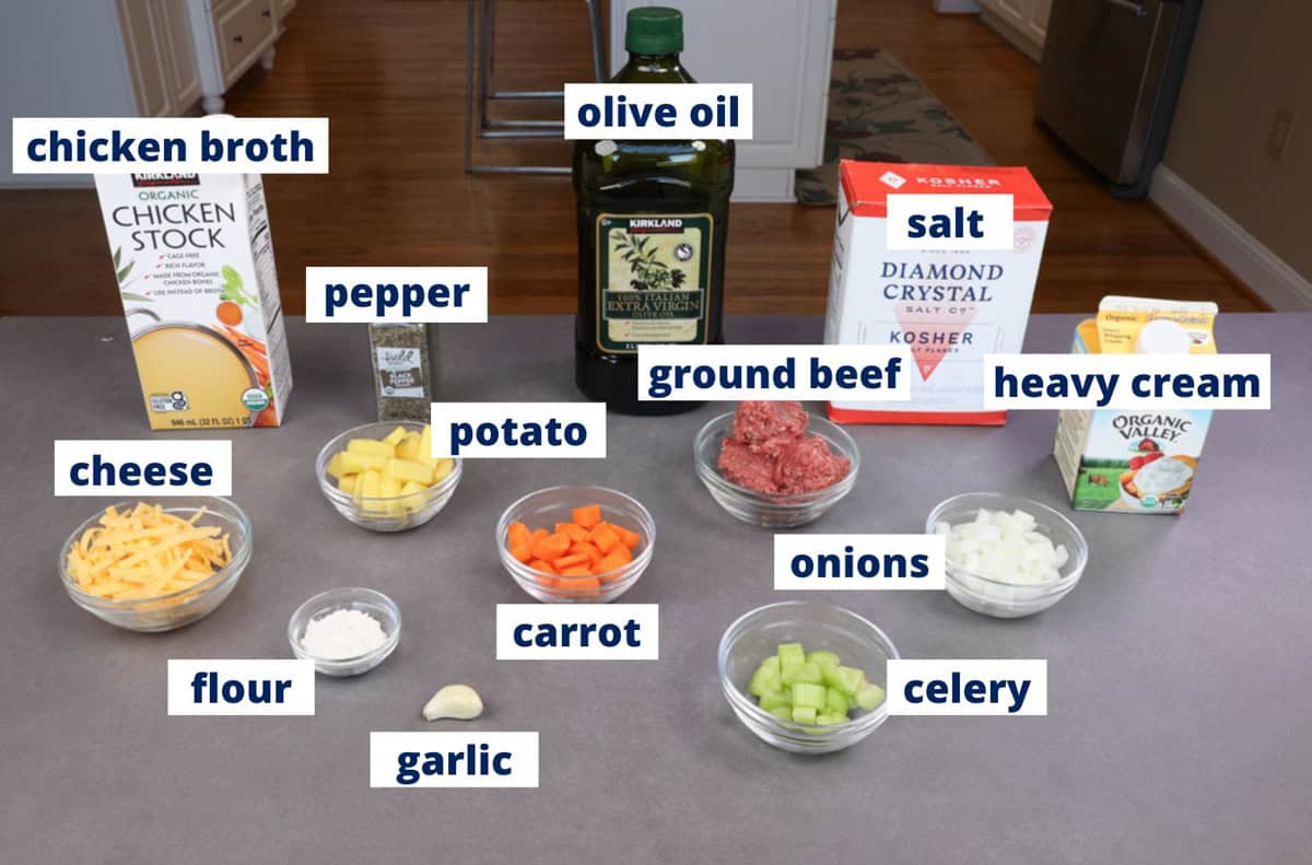 cheeseburger soup ingredients on a kitchen counter.