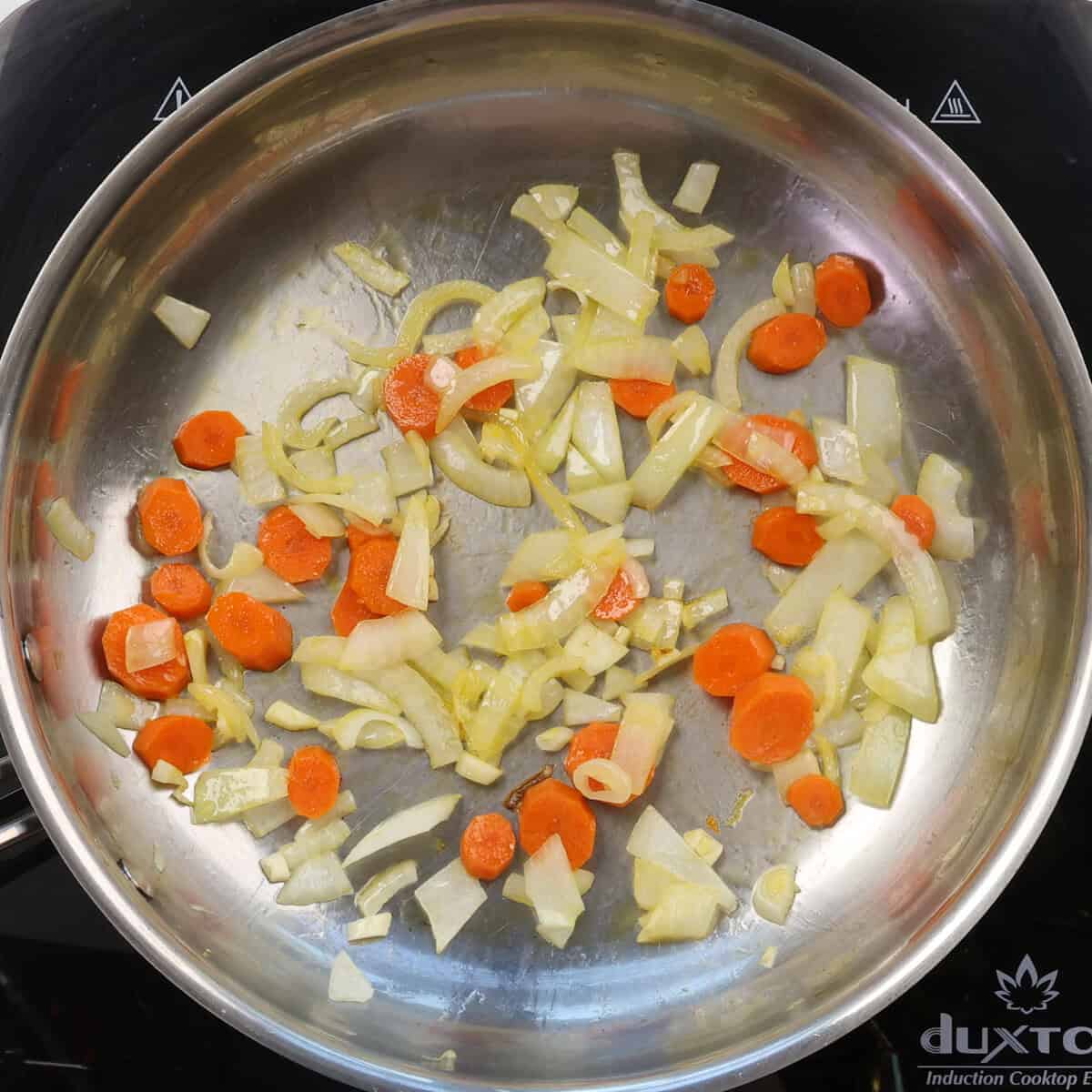 onions, carrots, and garlic in a skillet.