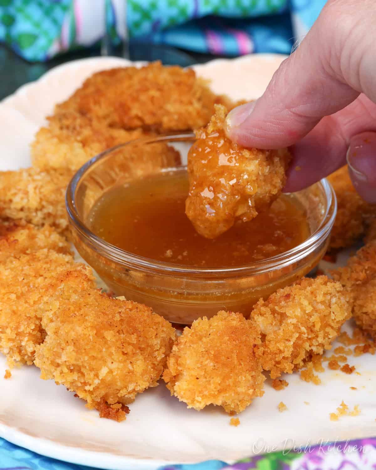 popcorn chicken with a dipping sauce.