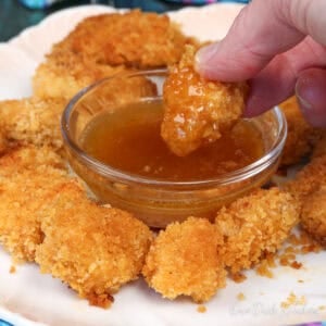 popcorn chicken with a dipping sauce.