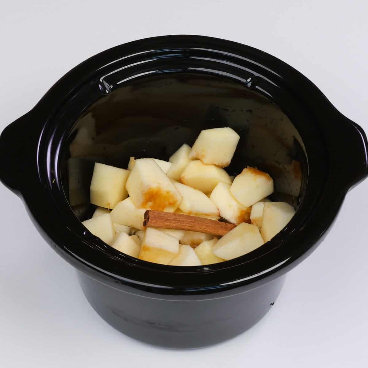 apples, water and sugar in a slow cooker.