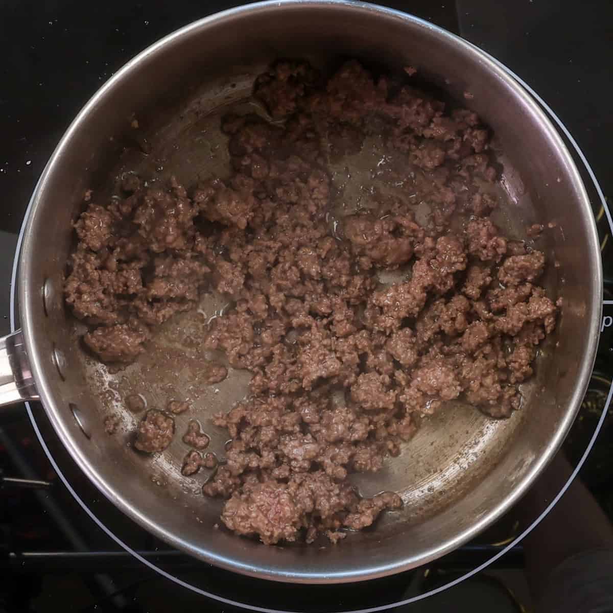 ground beef cooking in a pot.