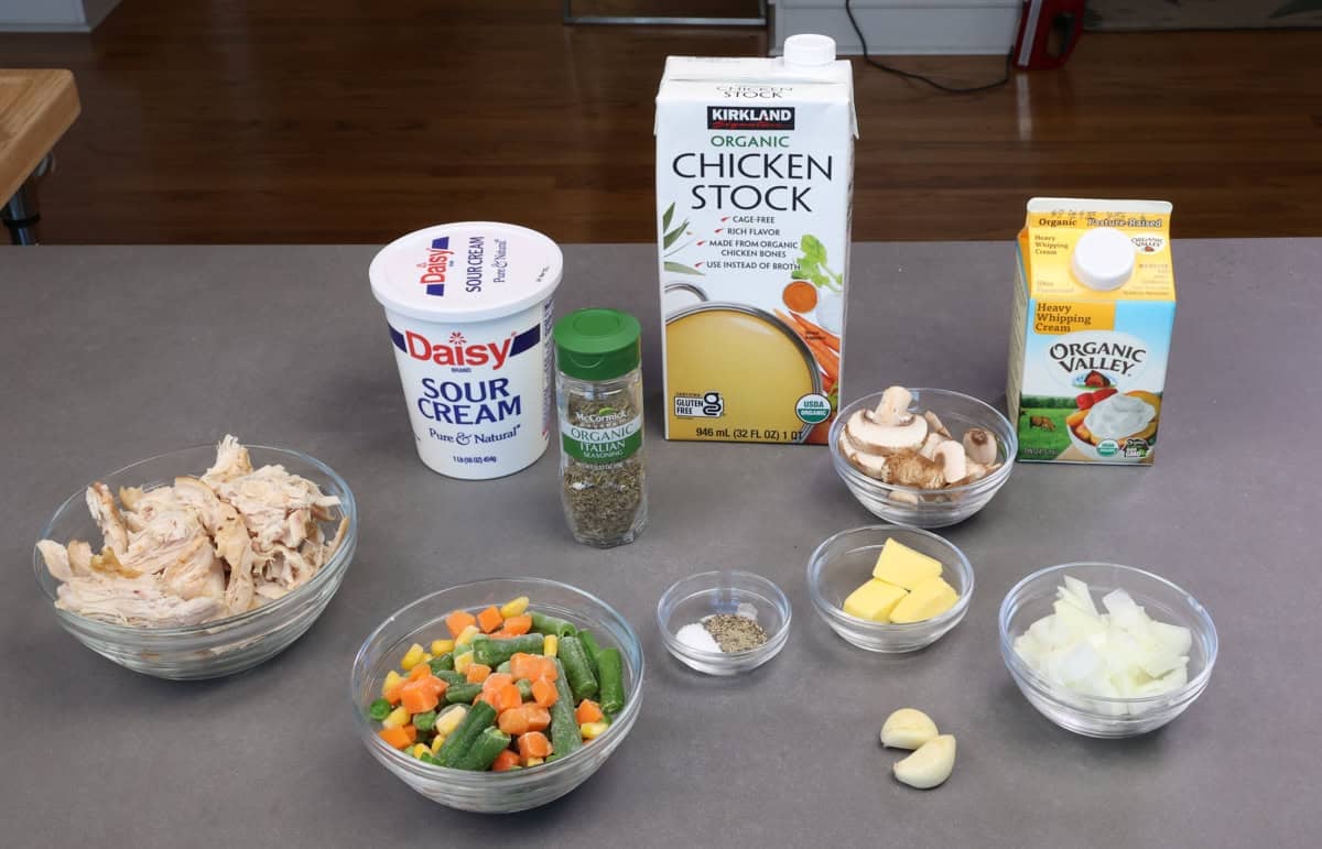 chicken and biscuits casserole ingredients on a kitchen counter.