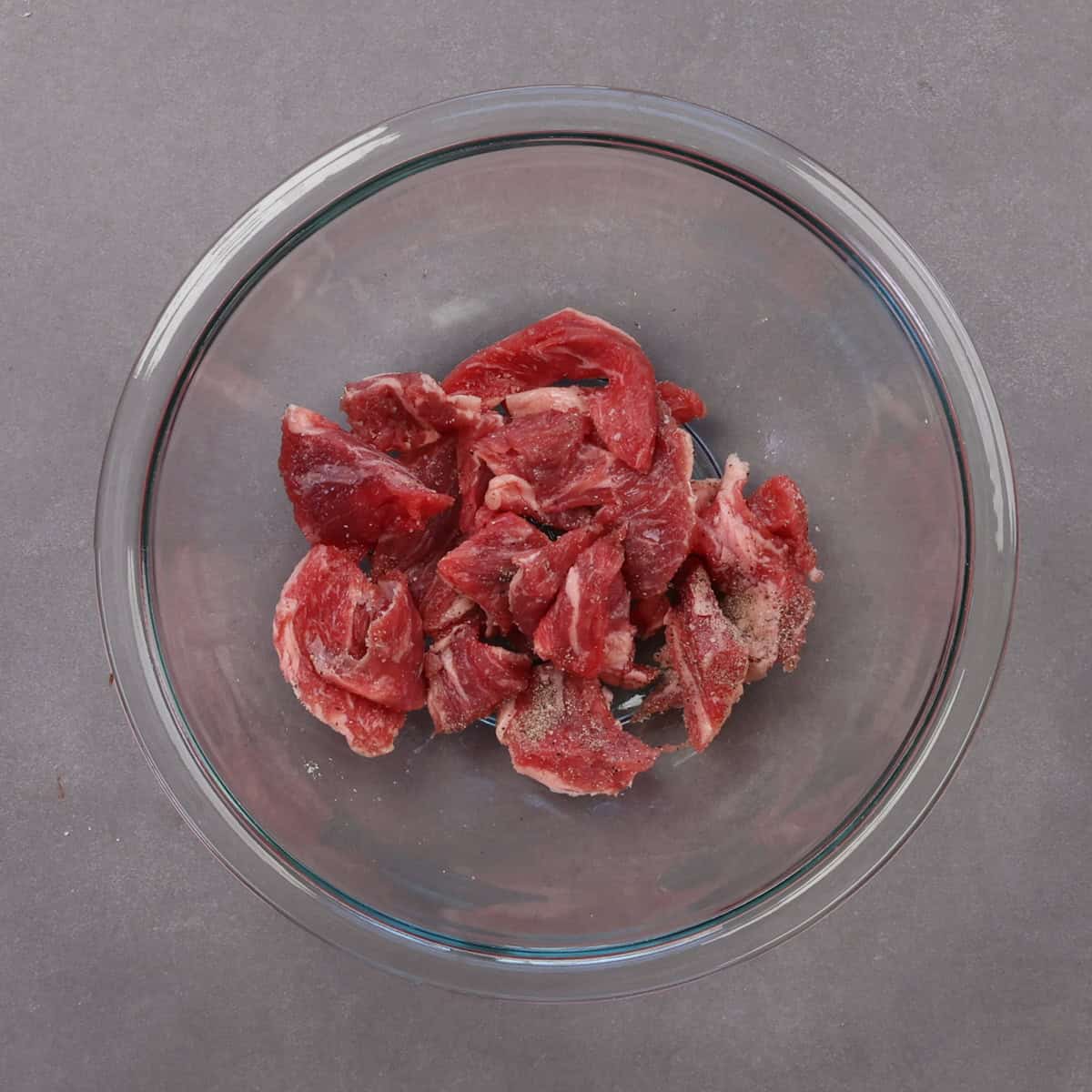 cubes of beef in a bowl.