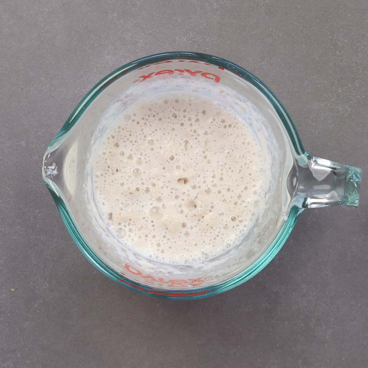 yeast and milk in a small bowl.