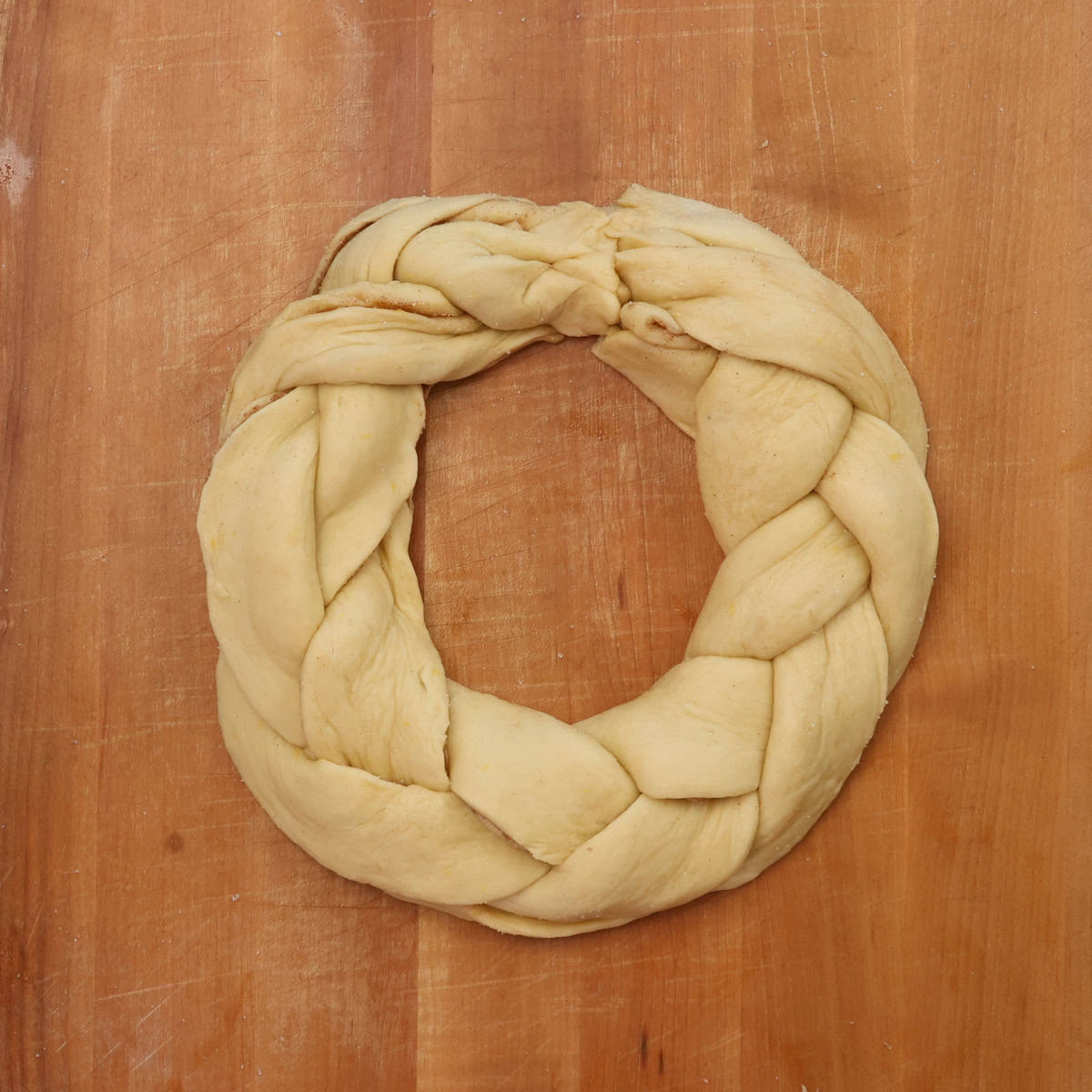 an unbaked braided king cake.