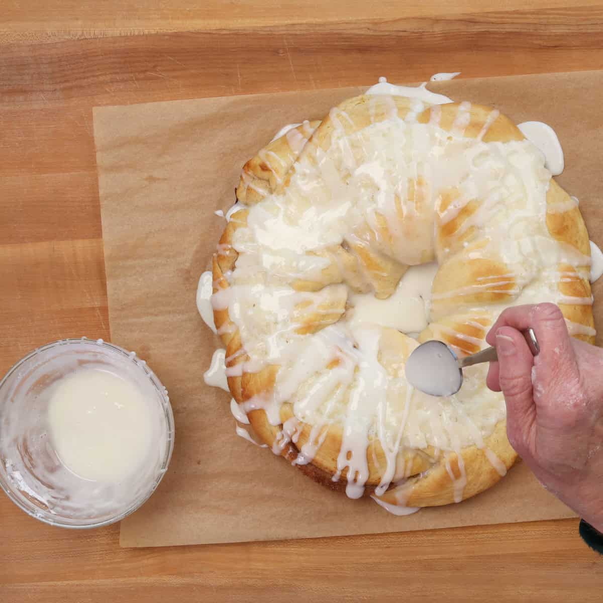 drizzling glaze over king cake.