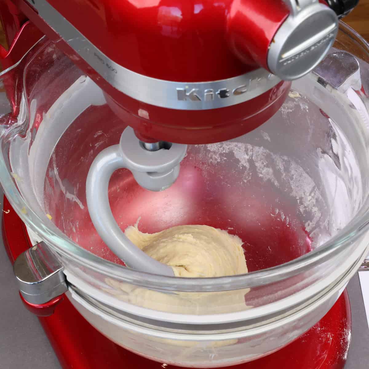 kneading king cake dough in an electric mixer.