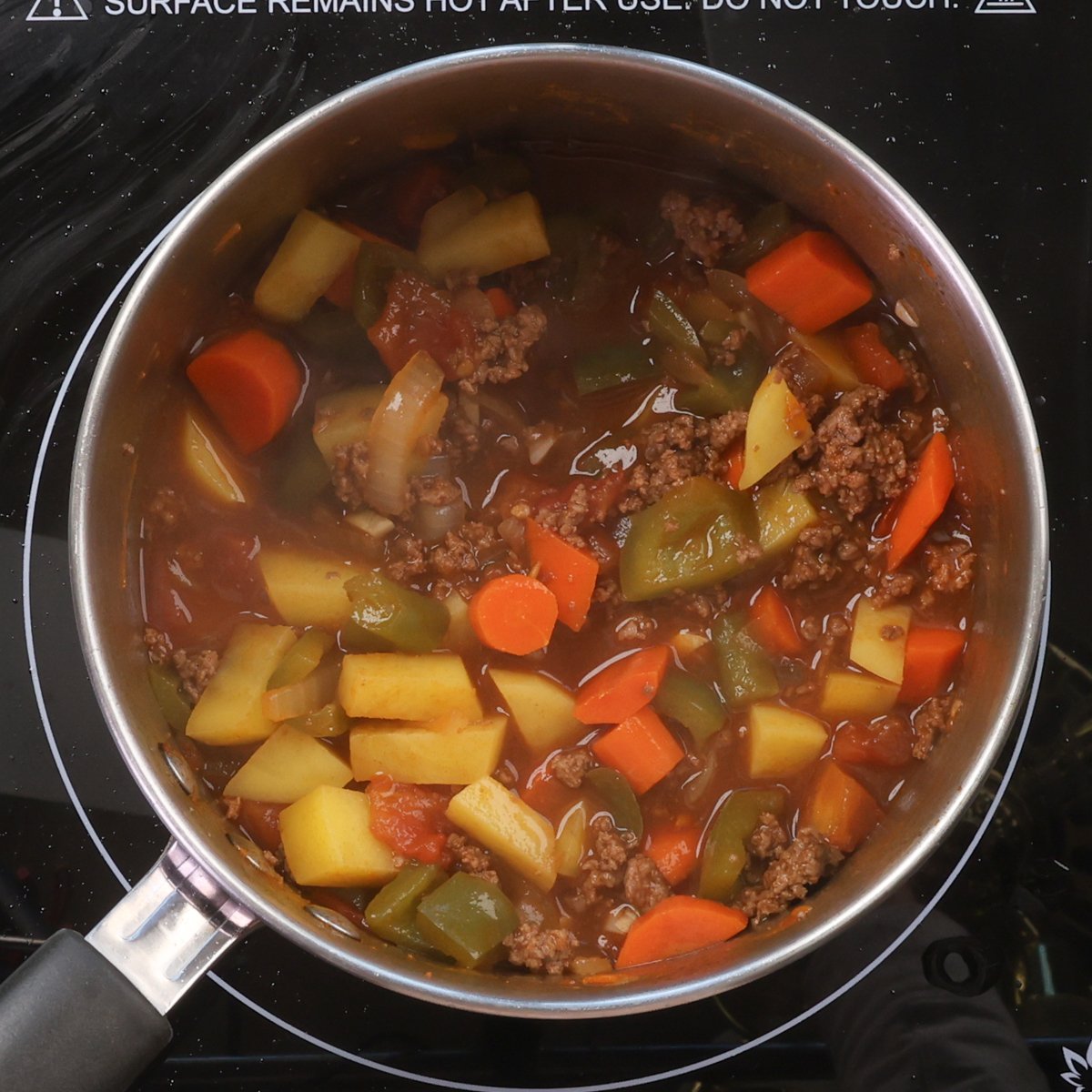 hamburger soup simmering in a pot.