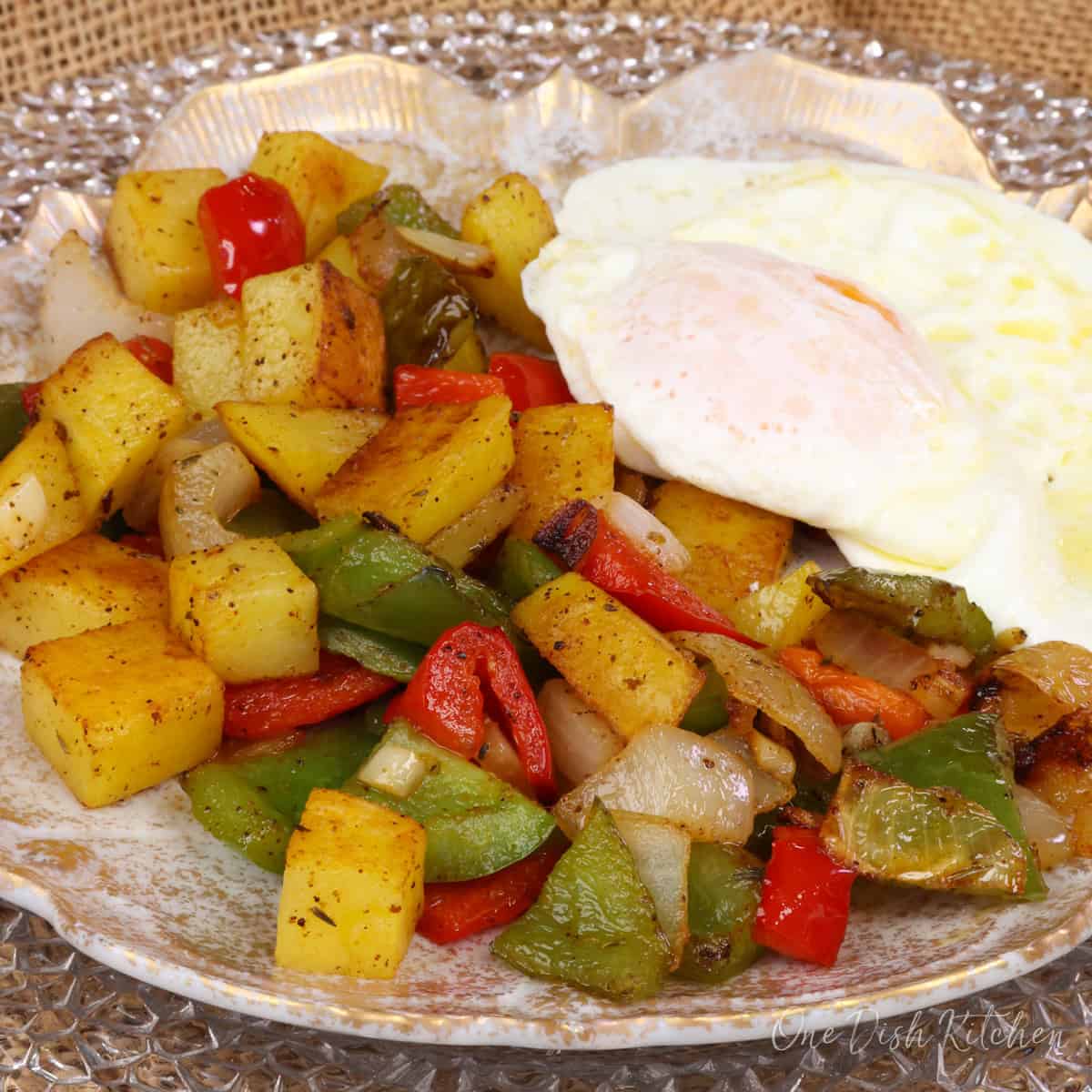 O'Brien potatoes with an egg on top.