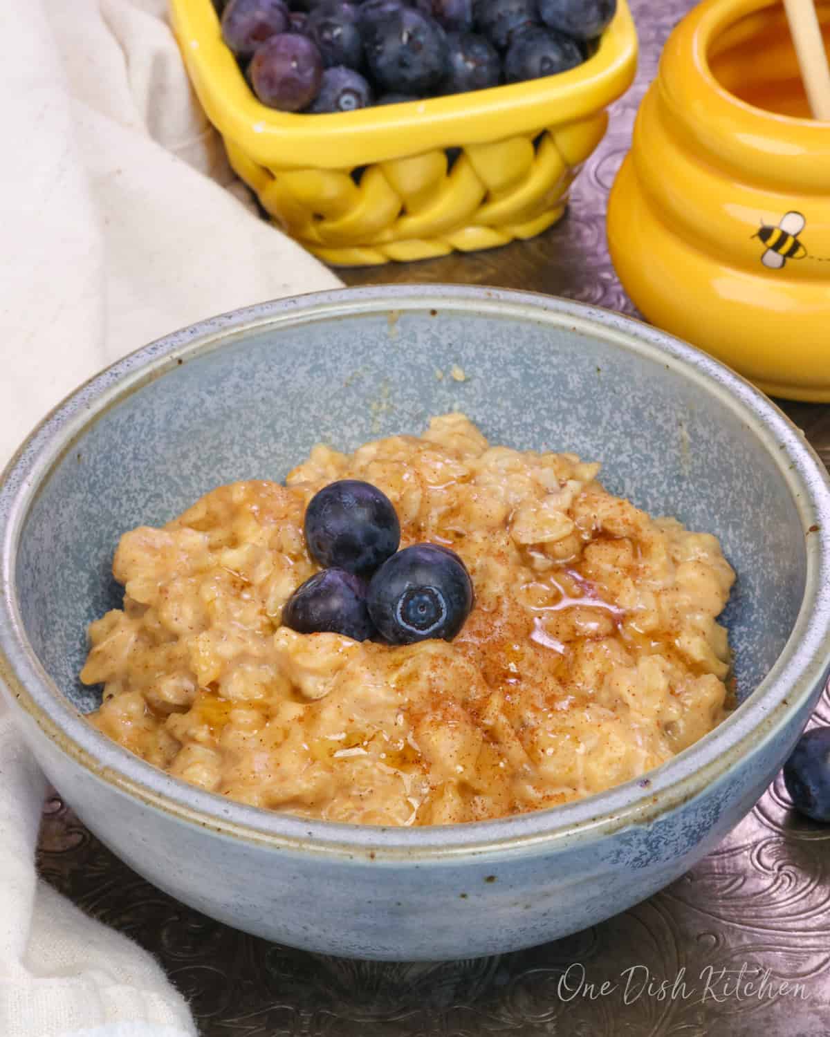 a bowl of oatmeal with peanut butter and berries.
