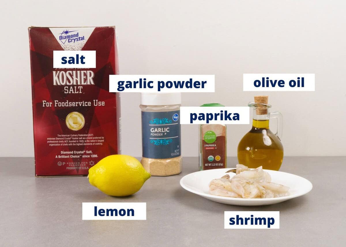 ingredients to make air fryer shrimp on a kitchen counter.