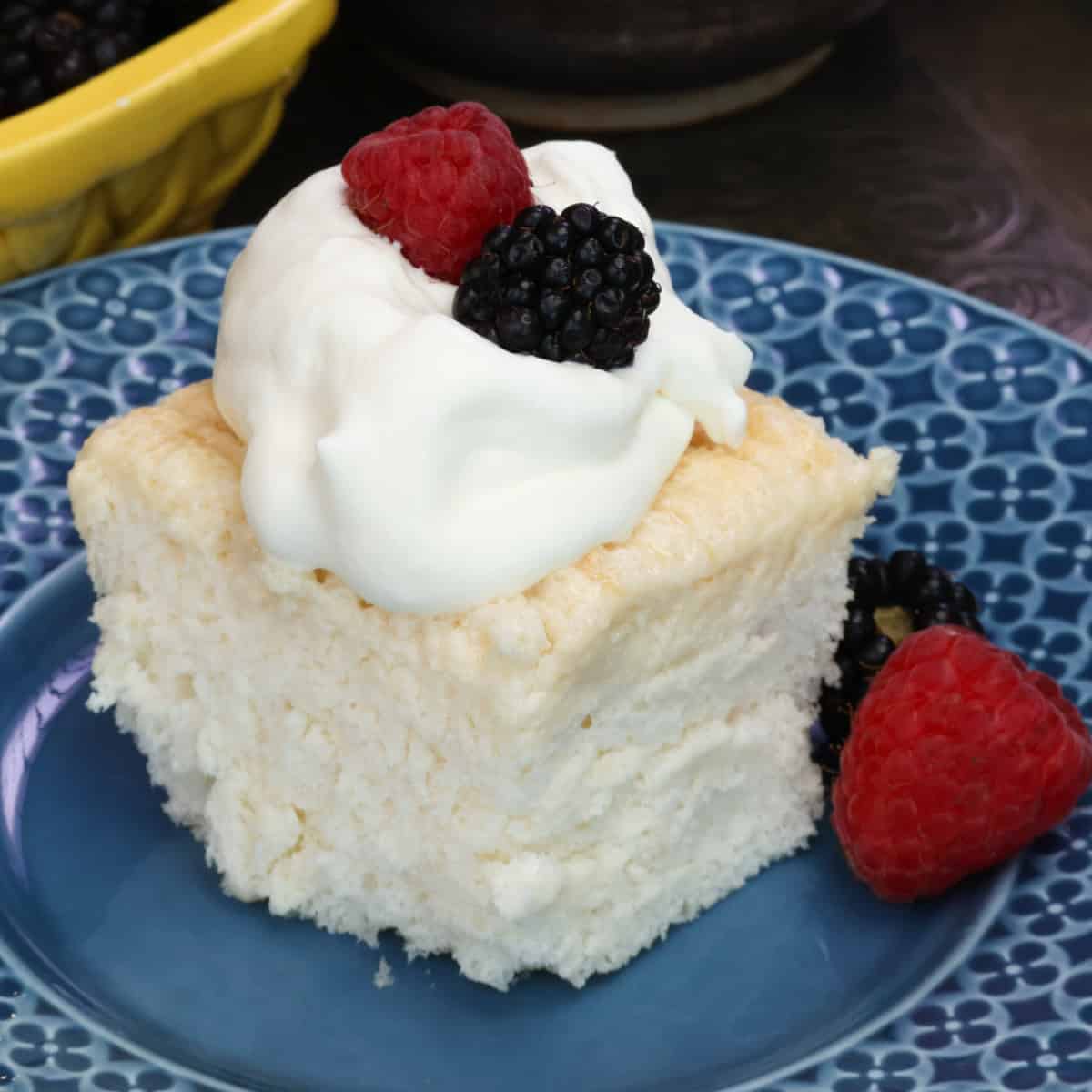 a slice of angel food cake on a blue plate.