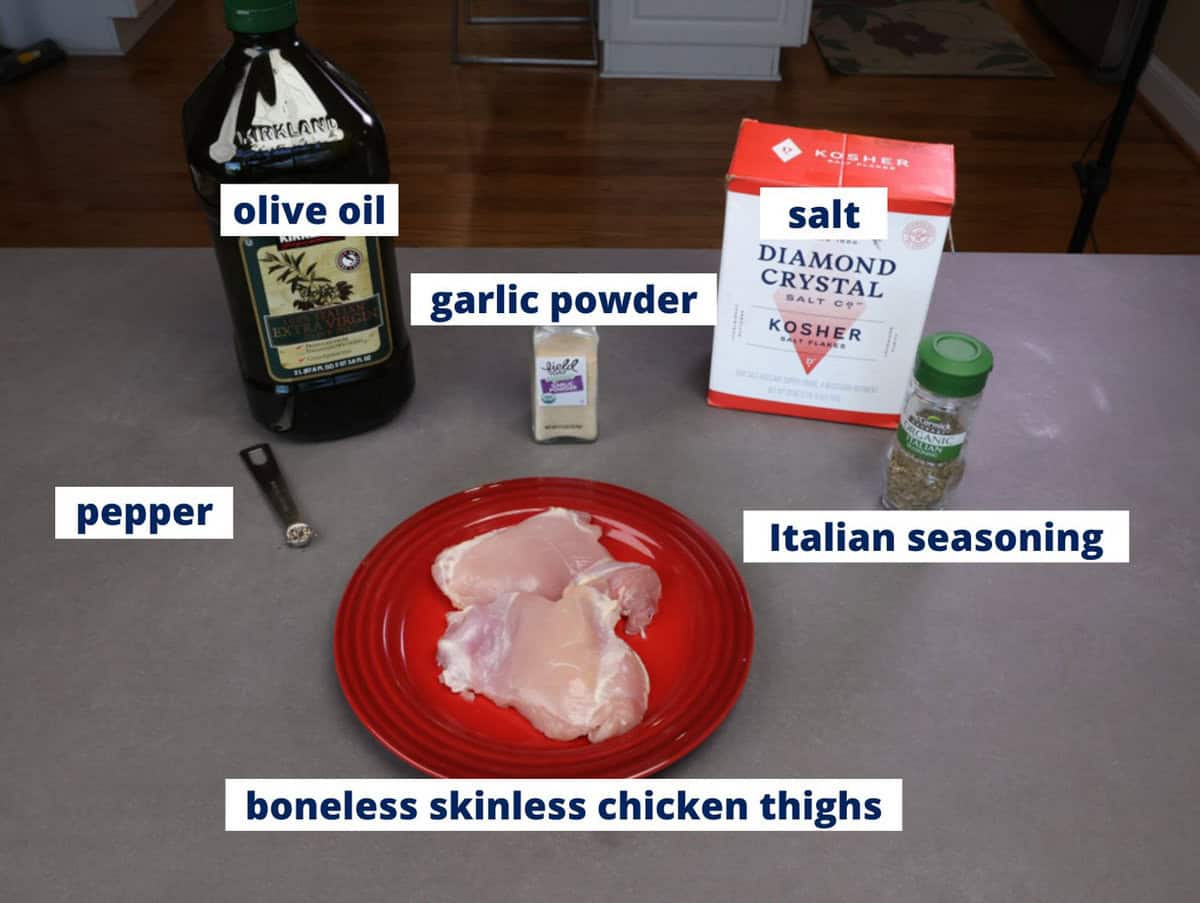 ingredients needed to bake boneless skinless chicken thighs on a kitchen counter.