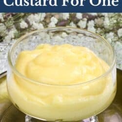 a single bowl of vanilla custard on a green plate.