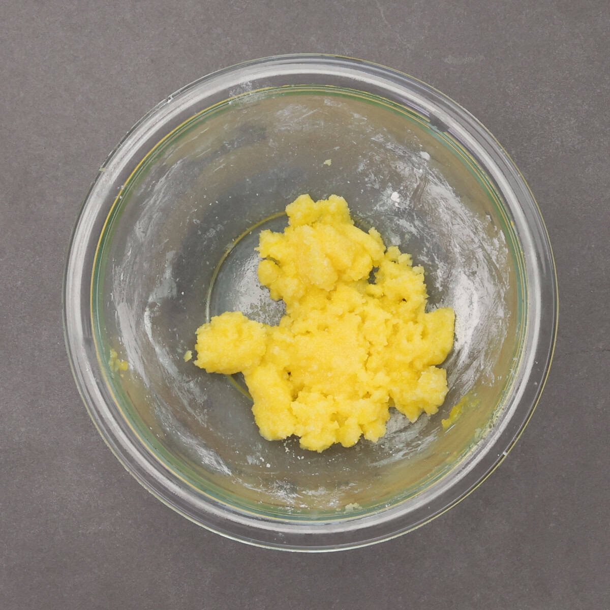 an egg yolk, sugar, and cornstarch whisked together in a small bowl.