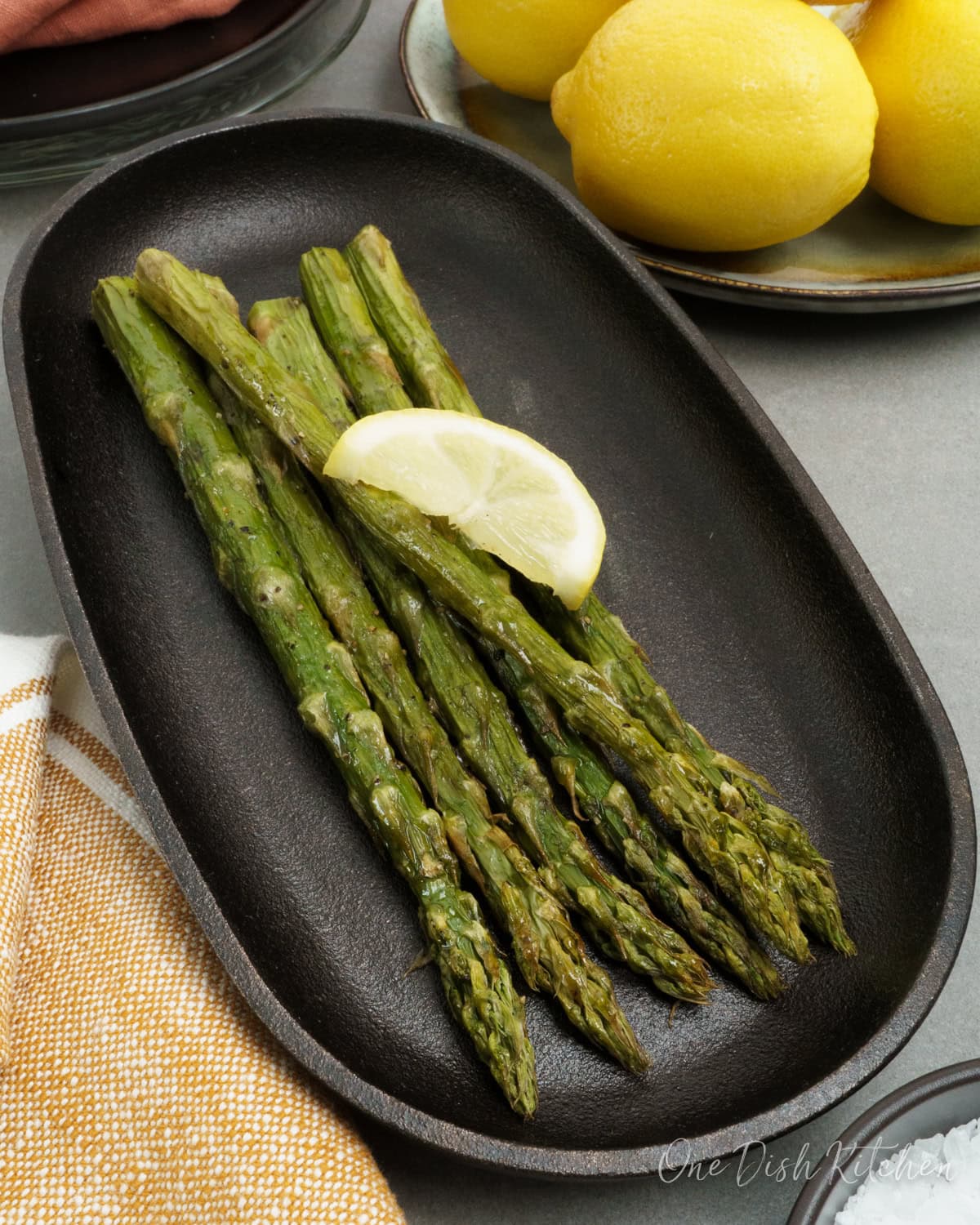 Make crisp, tender air fryer asparagus in under 10 minutes with this easy recipe. A quick, fresh side dish that goes with almost any meal.
