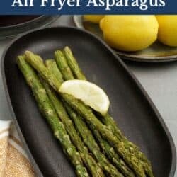 asparagus on a black plate.