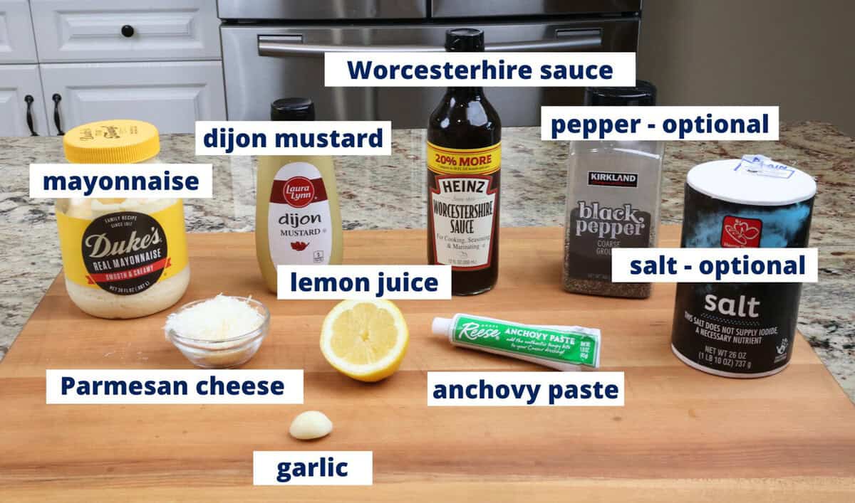 caesar dressing ingredients on a kitchen counter.
