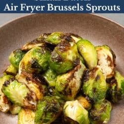 crispy air fryer brussels sprouts on a brown plate.
