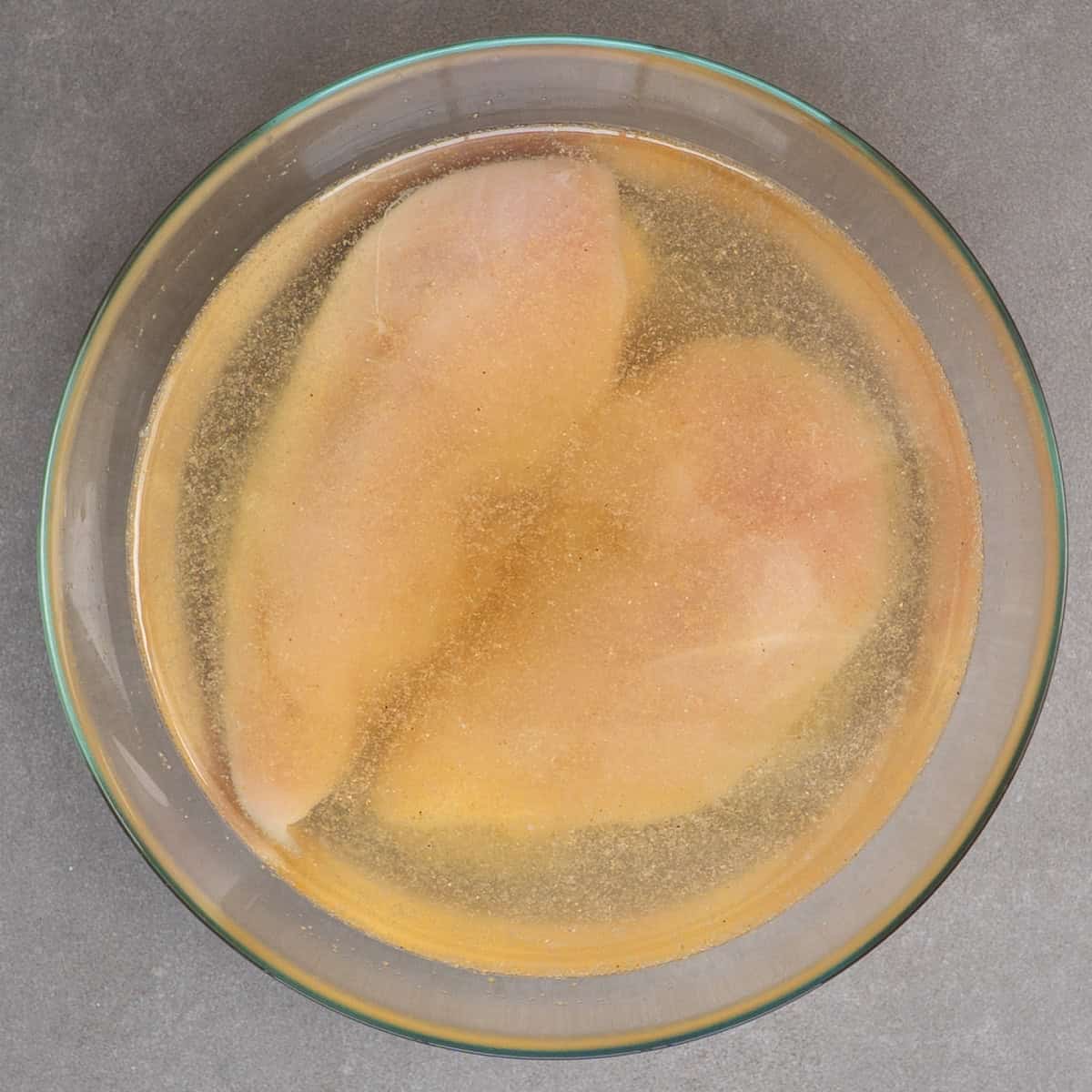 two chicken breasts in brine.