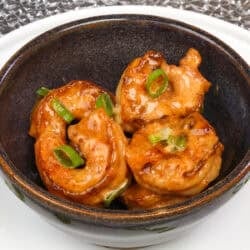 bang bang shrimp tossed in bang bang sauce in a bowl.