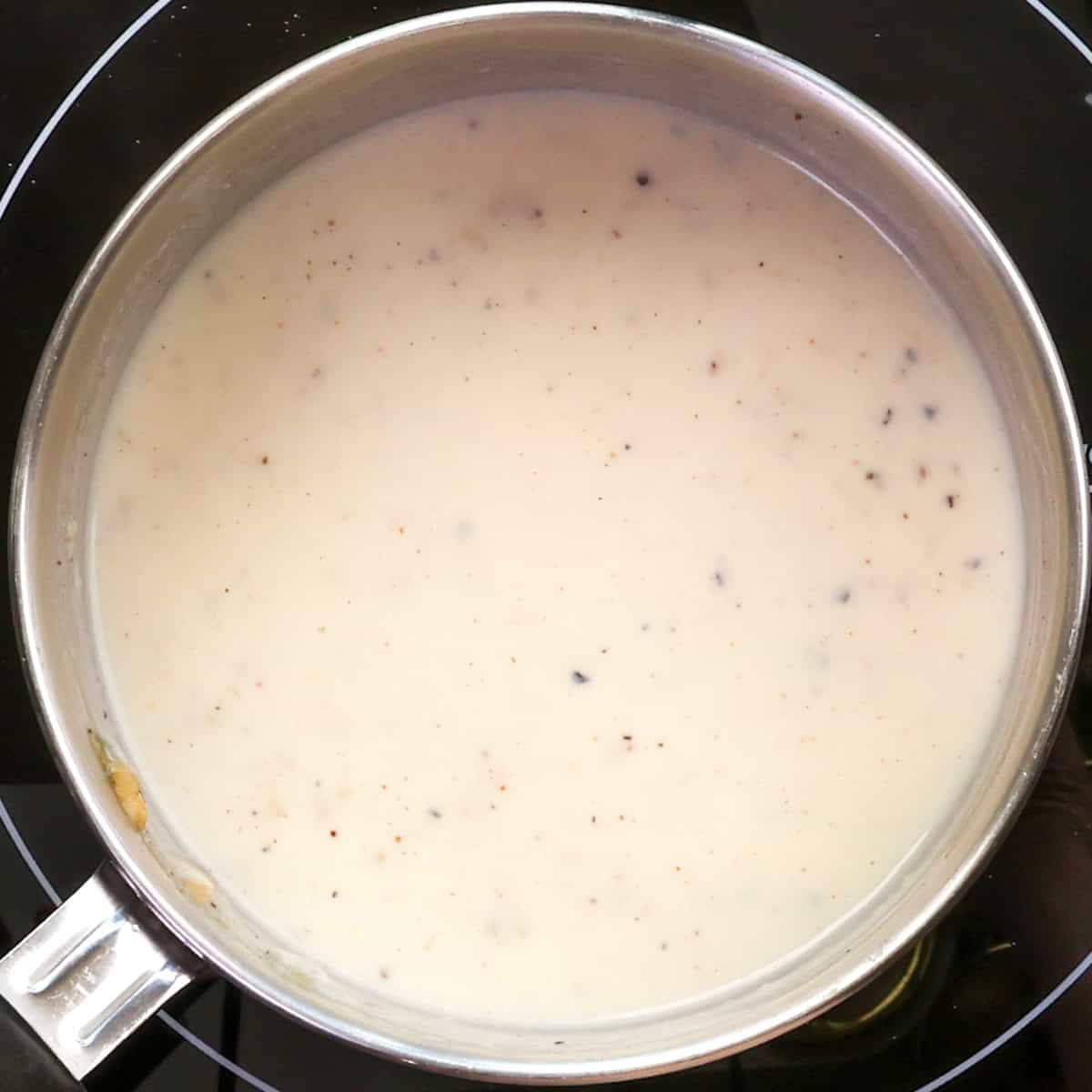 a small pot of homemade bechamel sauce.