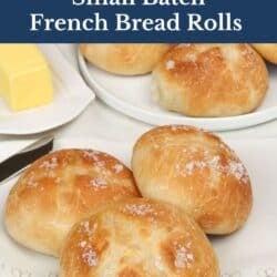 three french bread dinner rolls on a napkin.