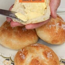 french bread rolls topped with butter.