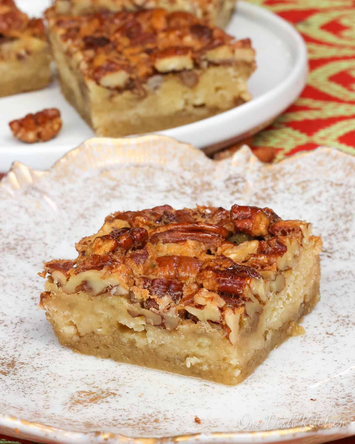 Small batch pecan pie bars without corn syrup on a plate.