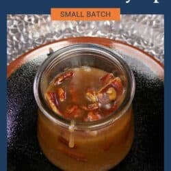 a small batch of homemade butter pecan syrup in a jar.