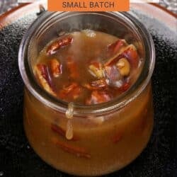 a small batch of homemade butter pecan syrup in a jar.
