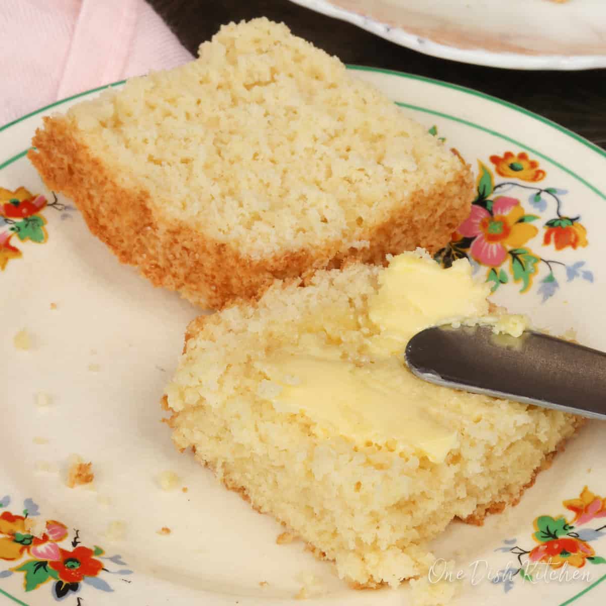 a slice of buttermilk bread with butter on a plate.