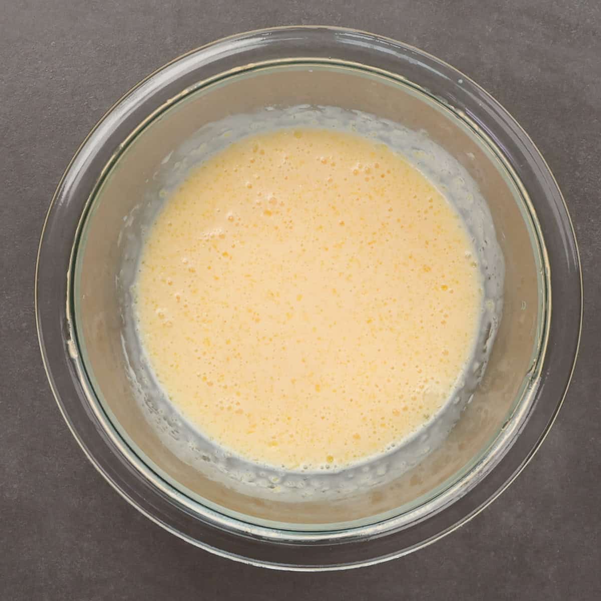 the wet ingredients for buttermilk bread in a bowl.