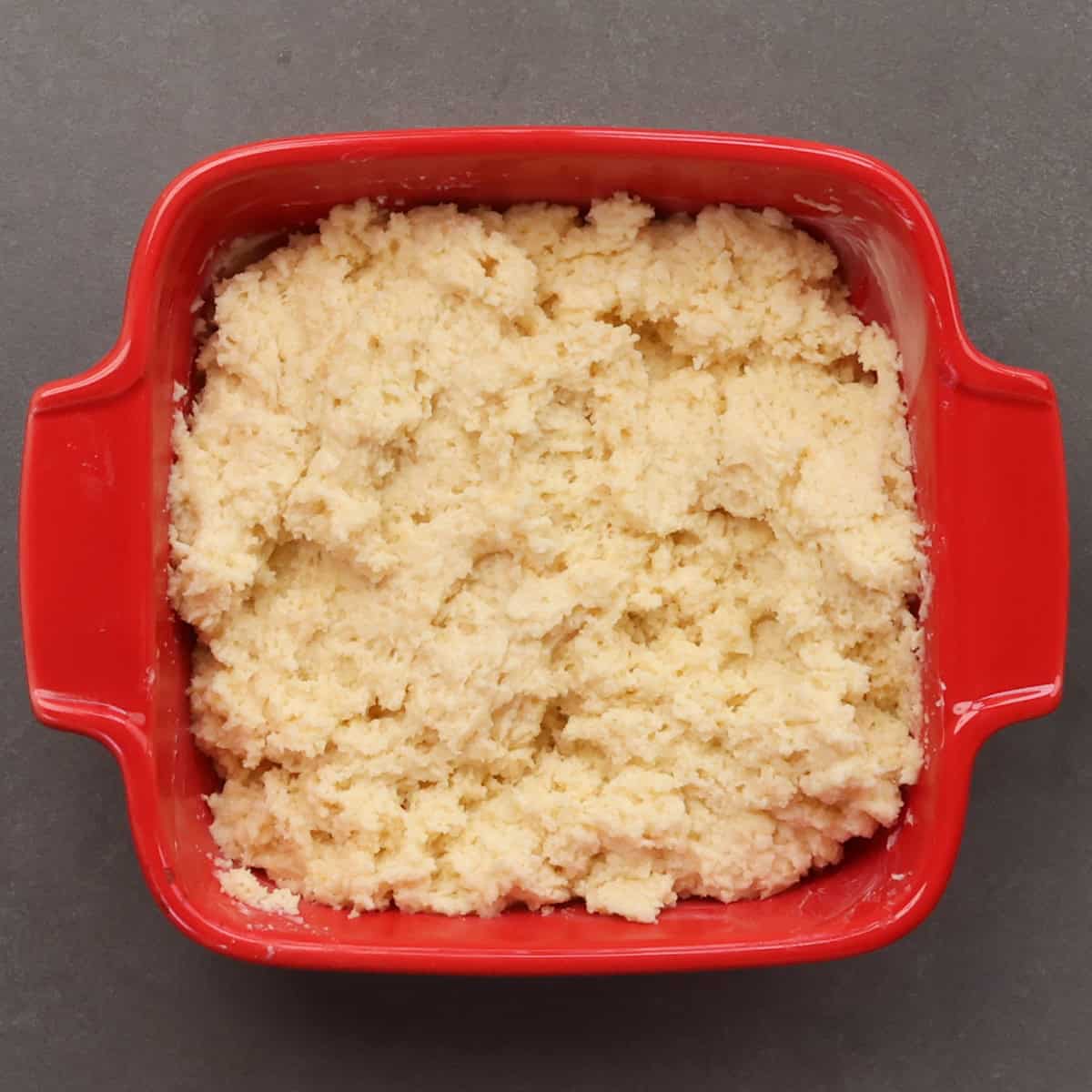 unbaked loaf of buttermilk quick bread in a small baking dish.