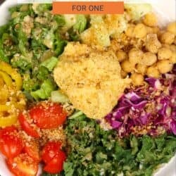 a small hummus crunch salad on a silver tray.