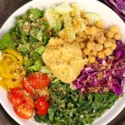 a hummus crunch bowl topped with breadcrumbs.