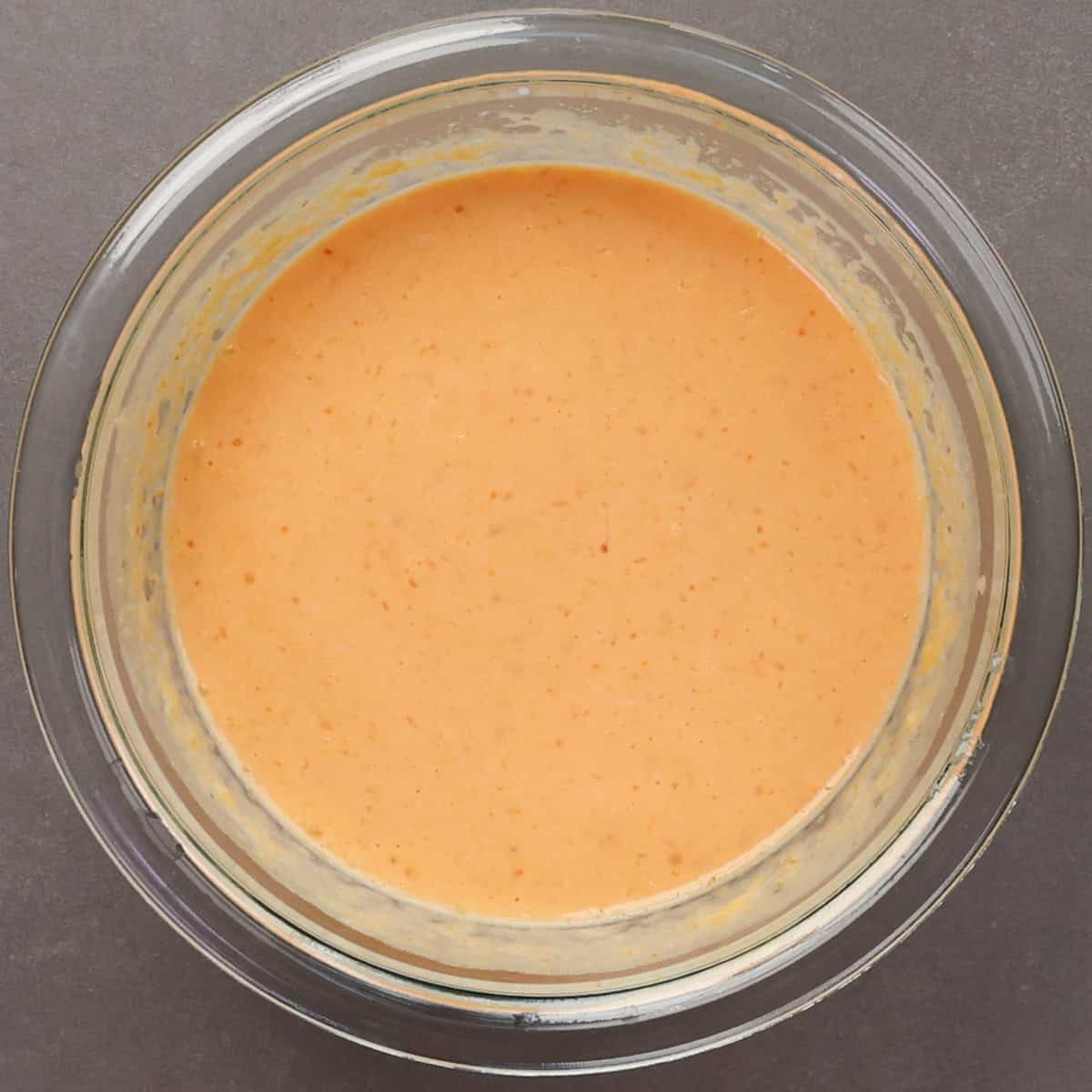 pumpkin pancakes wet ingredients in a mixing bowl.