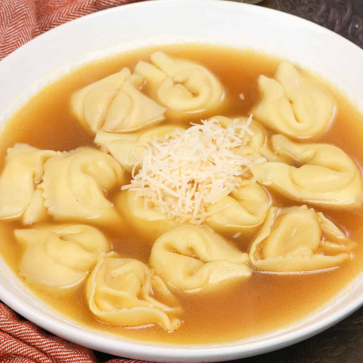 a bowl of homemade tortellini en brodo made with cheese tortellini.