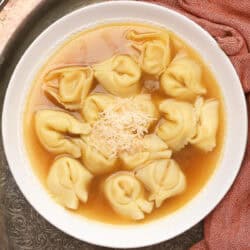 A bowl of tortellini en brodo made with store-bought chicken broth and cheese tortellini.