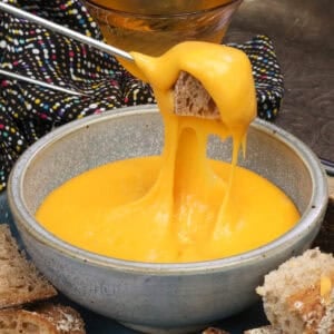 a small batch of cheese fondue with bread.