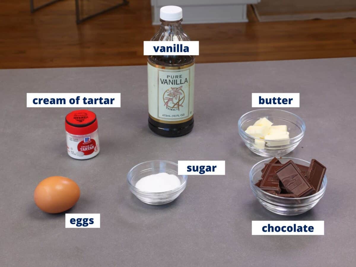 chocolate soufflé ingredients arranged on a kitchen counter.