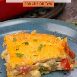 a single serving of king ranch chicken casserole on a blue plate.